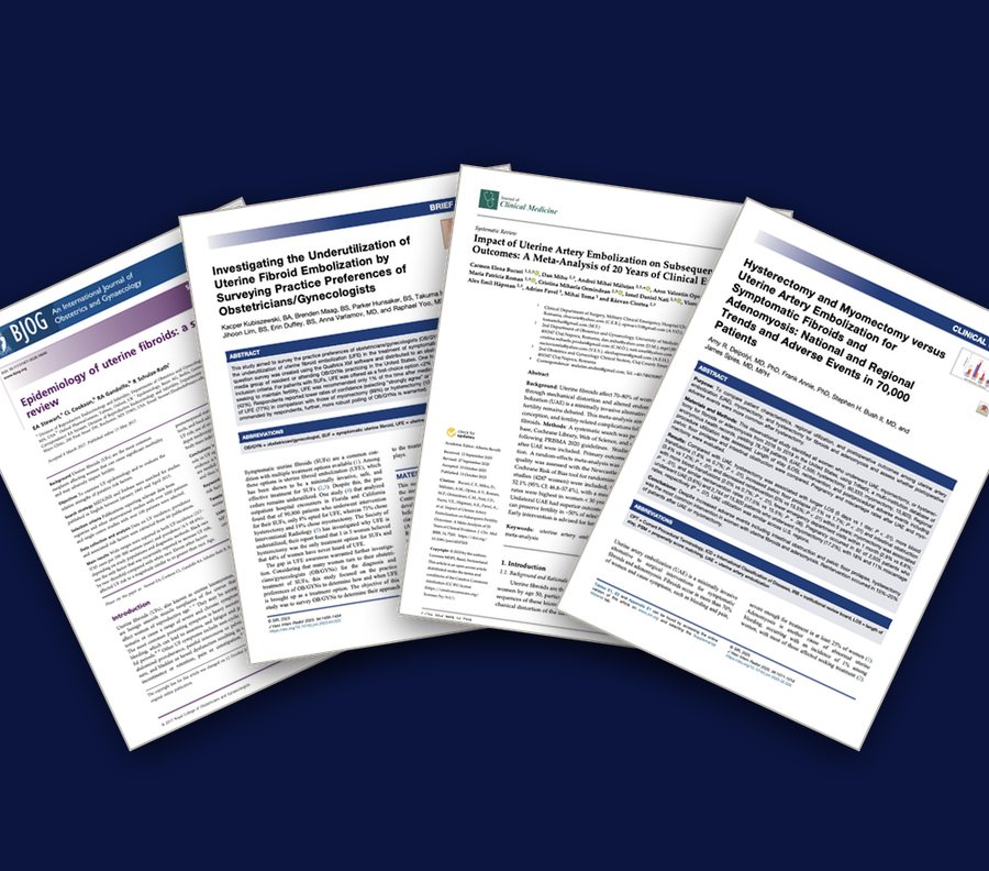 A fanned stack of published journal papers on uterine fibroid embolization