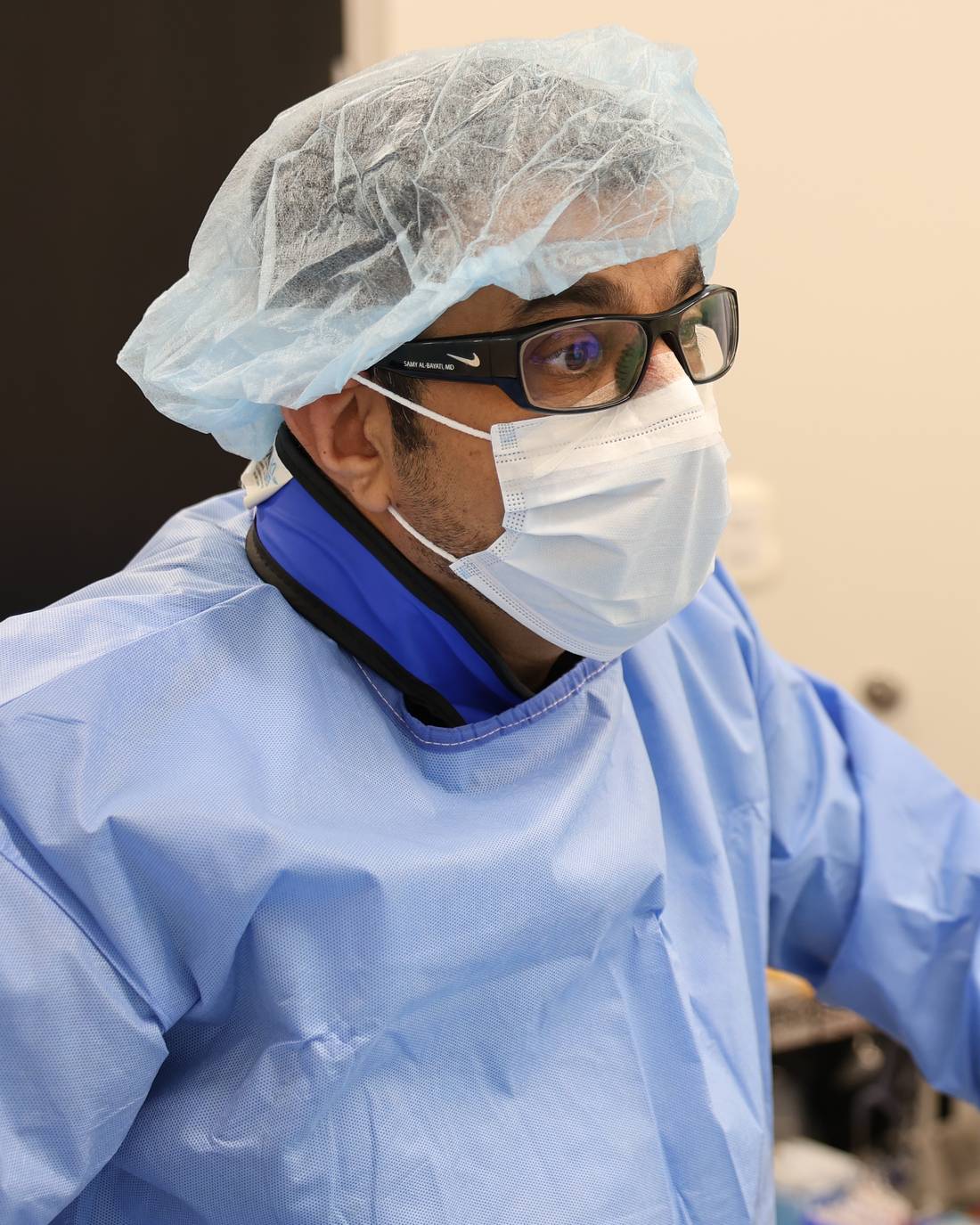 Dr. Samy Al-Bayati, in surgical cap and mask, performs an embolization procedure in the ARVC angiography suite